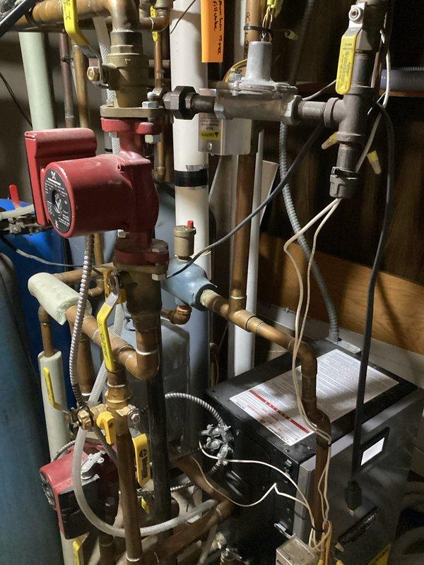 Responded to service call for a boiler system with air trapped in the loops. Thoroughly bled air from all zones in the baseboard fin tube heating system, properly filled the system with water, and successfully cycled through each zone to ensure complete air purging. Set water pressure to optimal level (20psi) and confirmed system returned to normal operation.