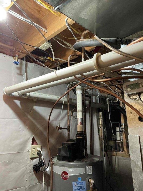Performed tune-up inspection on 21-year-old Goodman furnace. Discovered severe safety issues including leaking collector box seal and draft motor seal causing significant corrosion, plus multiple heat exchanger failures (pinholes around bends and large hole in primary heat exchanger). Combustion analysis confirmed elevated carbon monoxide levels with compromised flame pattern due to air infiltration through heat exchanger breach. System condemned as unsafe to operate; recommended immediate shutdown pending repair or replacement. Service advisor appointment scheduled.