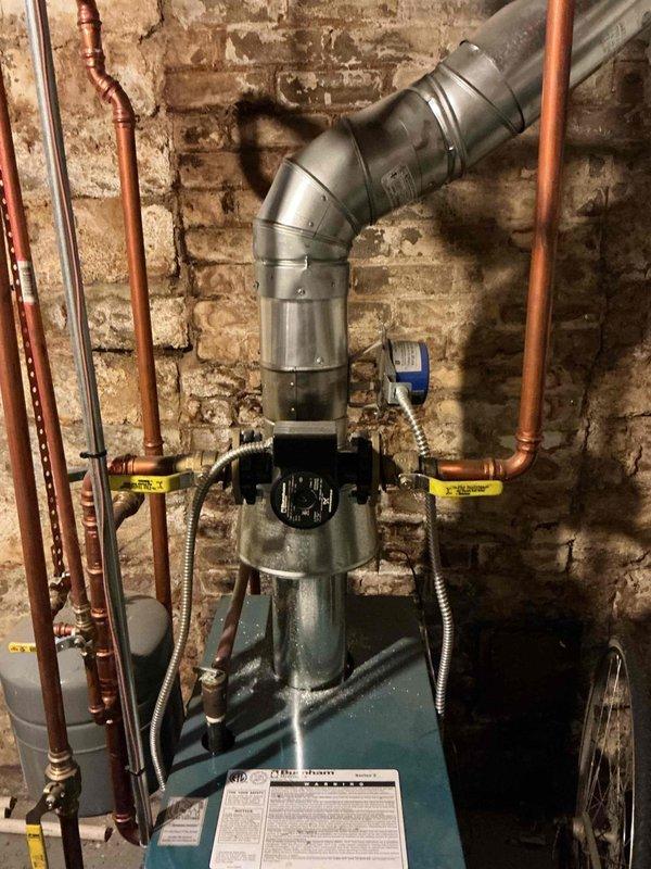 Responded to a service call regarding a leaking bleeder valve on a 15-year-old Burnham Series 2 boiler. Upon arrival, customer had already resolved the issue. Performed comprehensive inspection of the system including piping, system pressure, expansion tank, pressure relief valve, backflow preventer, venting, and combustion analysis. All components were found to be in good working condition with no CO leakage. System is operating safely and efficiently with no current issues requiring attention.