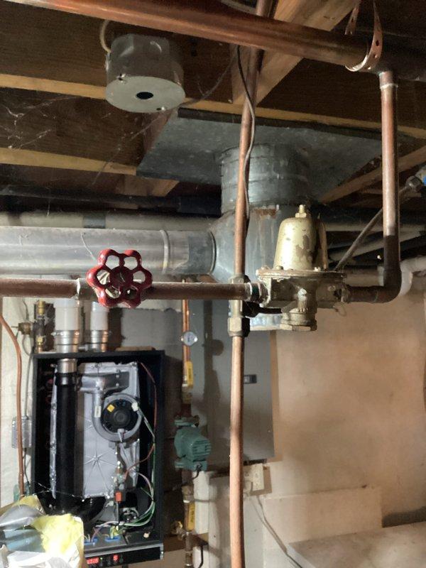 Responded to a no-heat call for a 3-year-old Alcivia boiler displaying error code L-P (low pressure). Diagnosed stuck auto fill valve preventing proper water addition to the system. Manually adjusted valve to restore functionality, successfully adding water to achieve proper operating pressure. Once pressure was restored, boiler ignited and resumed normal operation. Recommended replacement of several deteriorating components not included in original installation to prevent future pressure issues.