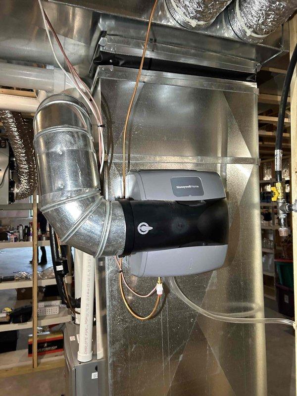 Performed 3-year maintenance tune-up on residential furnace system with integrated humidifier. Cleared condensation drain line of debris buildup, replaced dirty air filter, and cleaned flame sensor. Inspected and verified proper operation of blower wheel motor, inducer motor, gas pressure sensor, and pressure/limit switch. Carbon monoxide levels checked and system functioning properly after service.