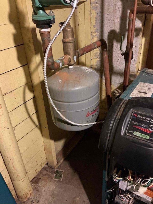 Responded to no-heat call on 12-year-old Burnham boiler. Diagnosed issue with thermostat wiring - customer had incorrectly placed R wire on Rc terminal instead of R terminal after recent thermostat replacement. Corrected wiring configuration, verified system operation, and confirmed boiler fired properly. Outdoor reset was active, limiting maximum temperature. Inspected all components with no additional issues found. Provided customer education on system operation.