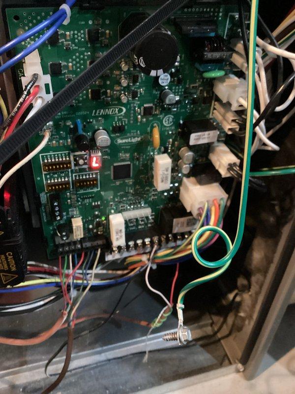 Responded to service call for Lennox furnace with error code 200 (open limit switch). Identified loose Molex plug connection at the control board as the source of the issue. Properly reconnected the connector and verified complete system operation. Furnace now functioning normally with no error codes present.