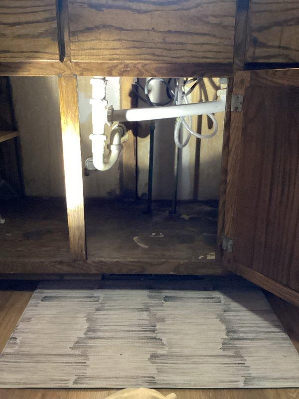 Responded to service call for kitchen sink clog and faucet leak. Performed drain snaking procedure to remove food waste blocking kitchen drain pipe (customer noted grandson disposed food incorrectly thinking disposal was present). Replaced faulty kitchen faucet to resolve persistent dripping issue.
