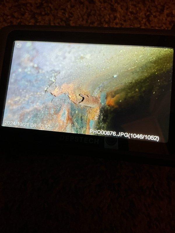 Responded to no-heat call for 27-year-old Intertherm furnace displaying 3 flash code (pressure switch closed). System fired up upon arrival but showed weak flame sense code. Inspection camera revealed significant heat exchanger deterioration with visible corrosion. Replaced pressure switch and ignition assembly to restore proper operation.