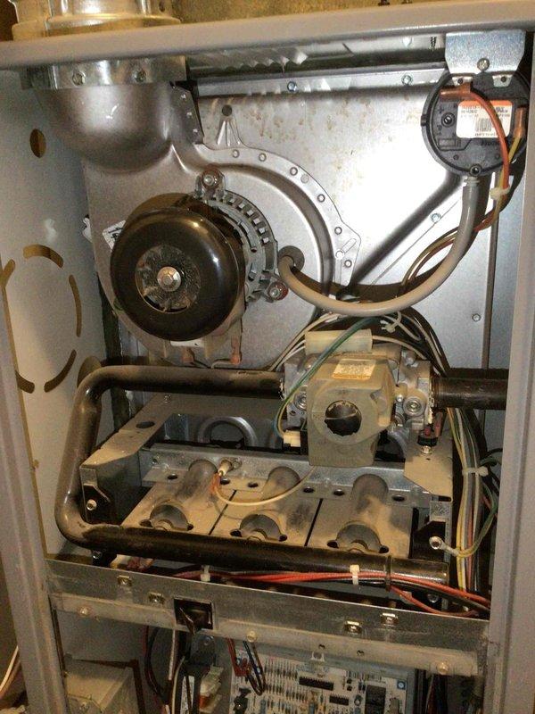 Performed preventative maintenance on 20+ year old original furnace. Inspected heat exchanger (no issues found), verified electrical components within specifications except for blower capacitor which was replaced. Cleared pressure hose, cleaned flame sensor, and restored system to proper operating condition.