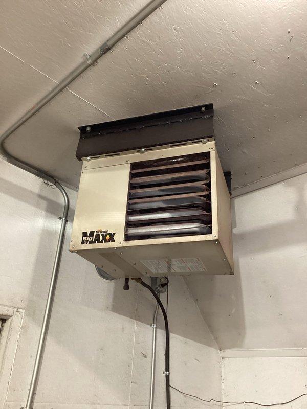 Diagnosed no heat issue on 5-year-old Mr. Heater wall-mounted unit. Determined thermostat signal failure to control board, attempted jumpering with no response. Installed customer-supplied replacement control board, which resolved the problem. Performed complete system check to confirm proper operation of all components. Unit now functioning correctly.