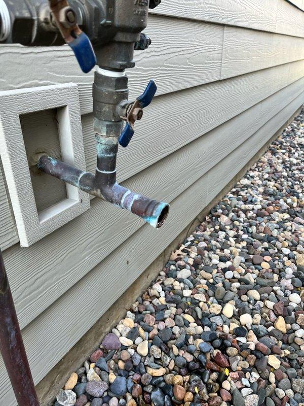 Diagnosed and replaced leaking 1" irrigation ball valve at exterior water supply line. Removed old valve assembly and installed new shut-off valve for the irrigation system. Confirmed proper operation with no leaks after installation.