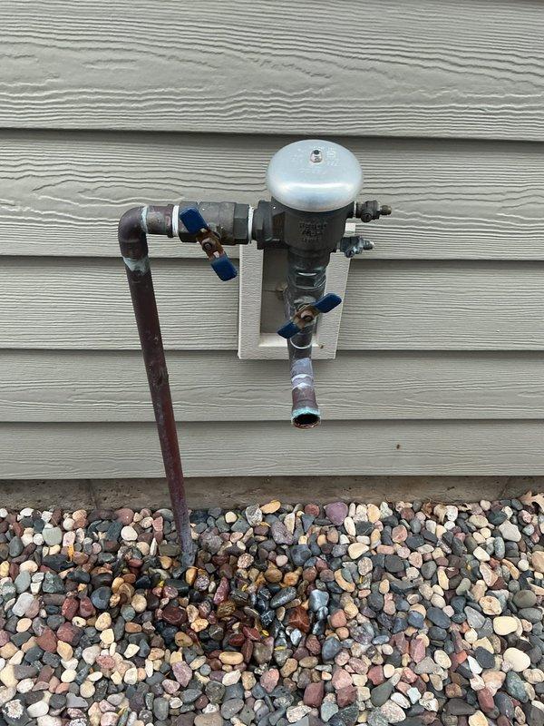 Diagnosed and replaced leaking 1" irrigation ball valve at exterior water supply line. Removed old valve assembly and installed new shut-off valve for the irrigation system. Confirmed proper operation with no leaks after installation.