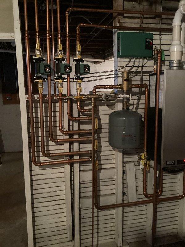 Responded to no heat complaint on IBC boiler system with error code 0015E3 and flashing orange/blue lights. Diagnosed air-locked zone valve preventing proper circulation, which manifested as one non-heating zone. Successfully purged air from the system by force-feeding the affected zone through manual valve operation and left air vents open to prevent recurrence of this seasonal startup issue.