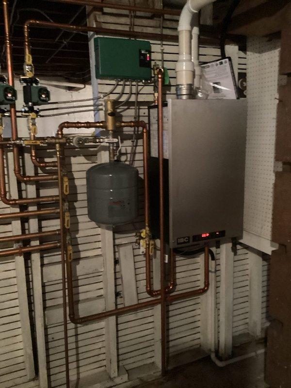 Responded to no heat complaint on IBC boiler system with error code 0015E3 and flashing orange/blue lights. Diagnosed air-locked zone valve preventing proper circulation, which manifested as one non-heating zone. Successfully purged air from the system by force-feeding the affected zone through manual valve operation and left air vents open to prevent recurrence of this seasonal startup issue.