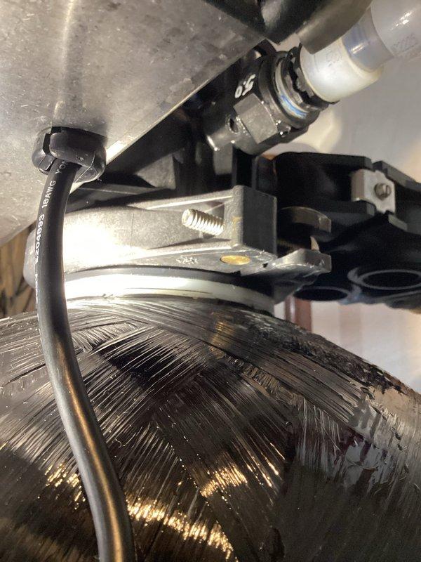 Responded to warranty service call for leaking iron mitigation system previously installed by our company. Upon inspection, found cracked female adapter at the discharge connection causing the leak. Identified replacement part needed and documented damage with photos for warranty claim processing.