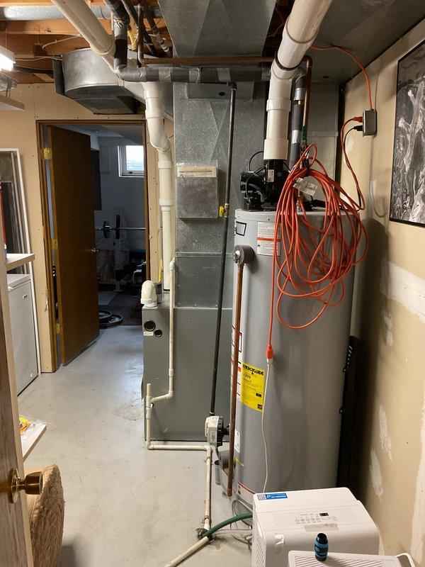 Responded to no-heat call for 25-year-old furnace in basement. Diagnosed issue as disconnected pressure switch tubing due to degradation. Reattached tubing and performed combustion testing which initially showed borderline CO readings (below 100 ppm airstream, 3 ppm on first test, zero on subsequent tests). Customer indicated plans to replace both furnace and AC system.