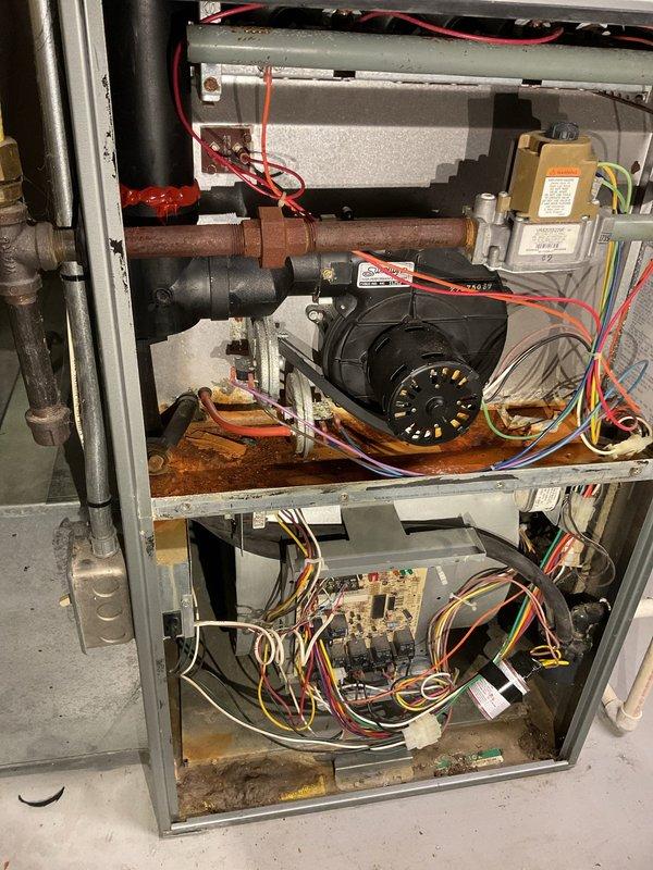 Responded to no-heat call for 25-year-old furnace in basement. Diagnosed issue as disconnected pressure switch tubing due to degradation. Reattached tubing and performed combustion testing which initially showed borderline CO readings (below 100 ppm airstream, 3 ppm on first test, zero on subsequent tests). Customer indicated plans to replace both furnace and AC system.