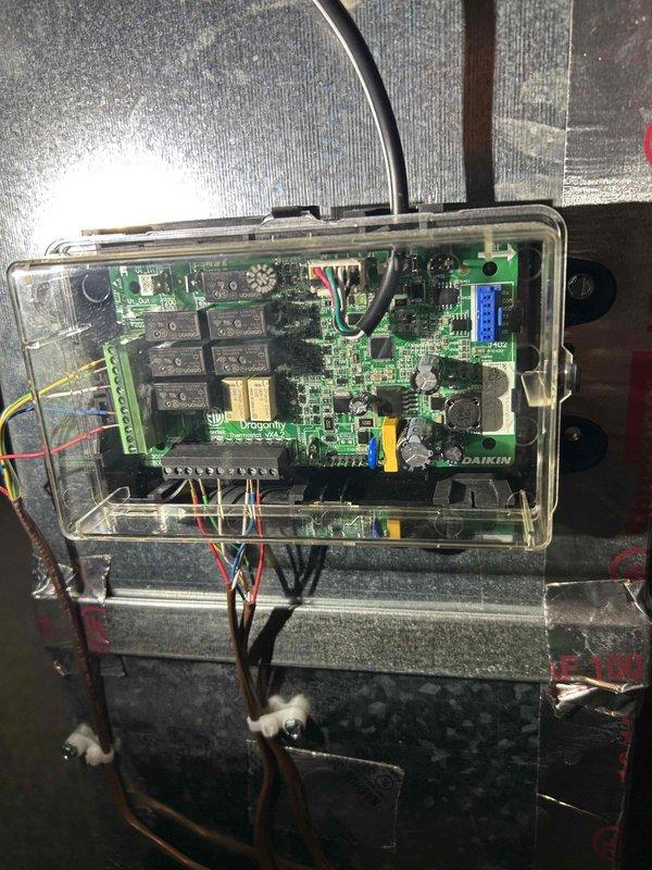 Performed routine maintenance on 10-year-old furnace showing signs of corrosion and rust buildup. Cleared condensation trap to address water leaking from ceiling pipes, removed accumulated dust and debris, and replaced filters with instruction to homeowner on future maintenance. Control board appears operational with proper wiring connections intact.