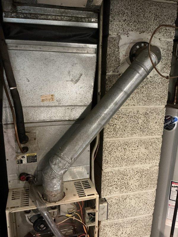 Responded to no-heat service call for aging furnace system. Upon inspection, discovered severely cracked heat exchanger and seized blower motor rod that prevented successful motor replacement. Provided customer with replacement options and scheduled follow-up sales consultation to discuss system replacement recommendations due to safety concerns.