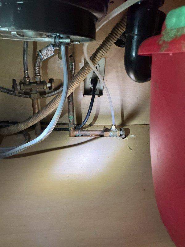 Responded to service call regarding leaking refrigerator water line and faulty dishwasher valve. Successfully capped off the water line connected to the refrigerator, eliminating the leak source. Additionally addressed issues with dishwasher by capping the line and plugging the disposal to prevent further water damage.