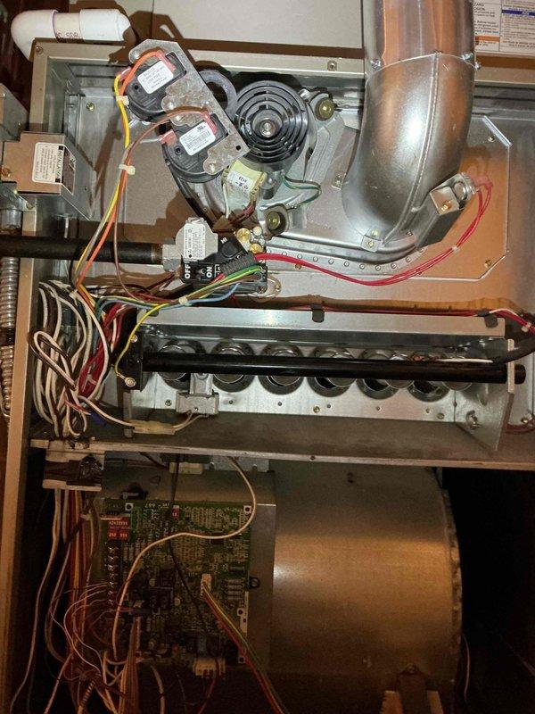 Responded to no heat call for a 9-year-old natural gas Bryant furnace. Diagnosed failed variable speed ECM motor that would not activate during fan-only or heating cycles. Confirmed motor failure through resistance testing and observed corresponding error code on control board. Identified additional wear on heat exchanger and age-related component deterioration throughout system. Reviewed replacement options with homeowner.