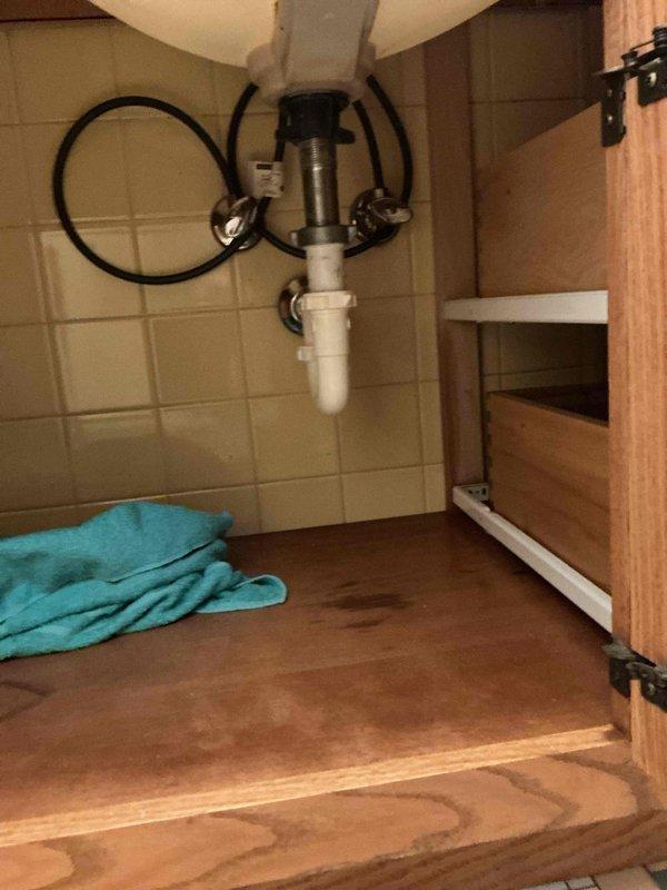 Responded to a service call regarding a leak under bathroom sink. Upon inspection, determined the Grohe lavatory faucet was leaking from a non-repairable location. Completed installation of a new lavatory faucet, resolving the issue.