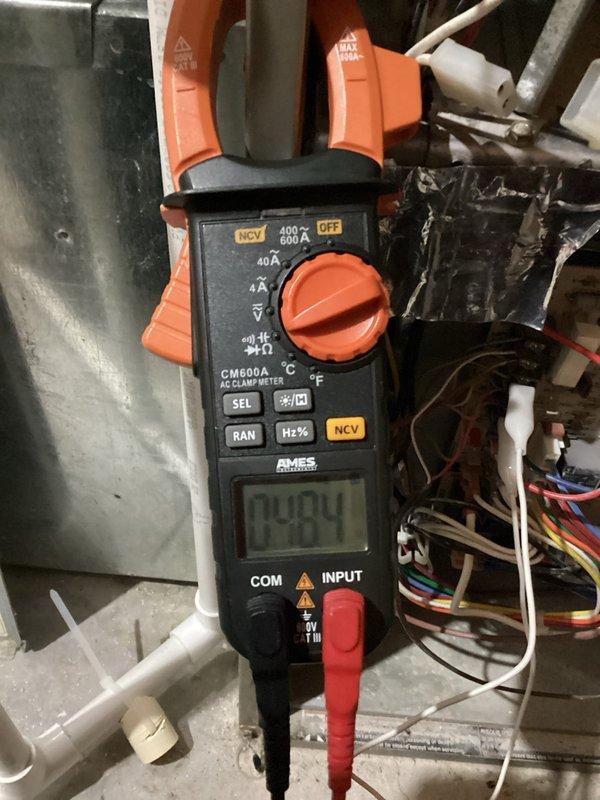 Performed routine maintenance on 18-year-old Carrier furnace that is nearing end of life expectancy (15-20 years). System is operating safely with appropriate gas pressures, cleaned flame sensor, verified proper ignitor function, and confirmed good amp draws on inducer and blower motors (0.94A). Heat exchanger shows some dark spotting; filter and condensation drains are clear.