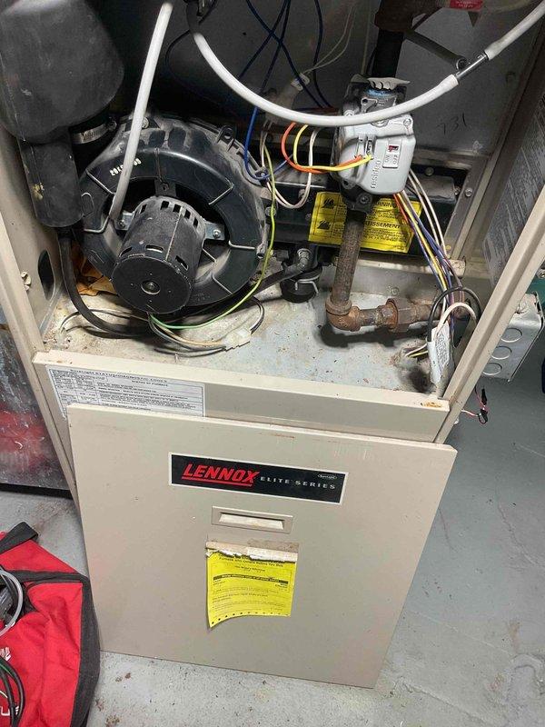 Performed comprehensive furnace tune-up on Lennox Elite Series natural gas furnace (100,000 BTU). Diagnostic testing with combustion analyzer showed O2 at 15.0%, CO at 10ppm, and CO2 at 4.1%. Identified failing inducer motor exhibiting signs of wear and replaced due to age to prevent potential system failure.