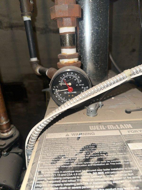 Diagnosed no heat complaint on 12-year-old Weil McLain boiler. Found system pressure at zero and failed thermostat. Demonstrated proper boiler filling procedure to homeowner and verified all components were functioning properly after pressure was restored. Jumper test confirmed thermostat failure as the primary issue; homeowner opted to replace thermostat independently.