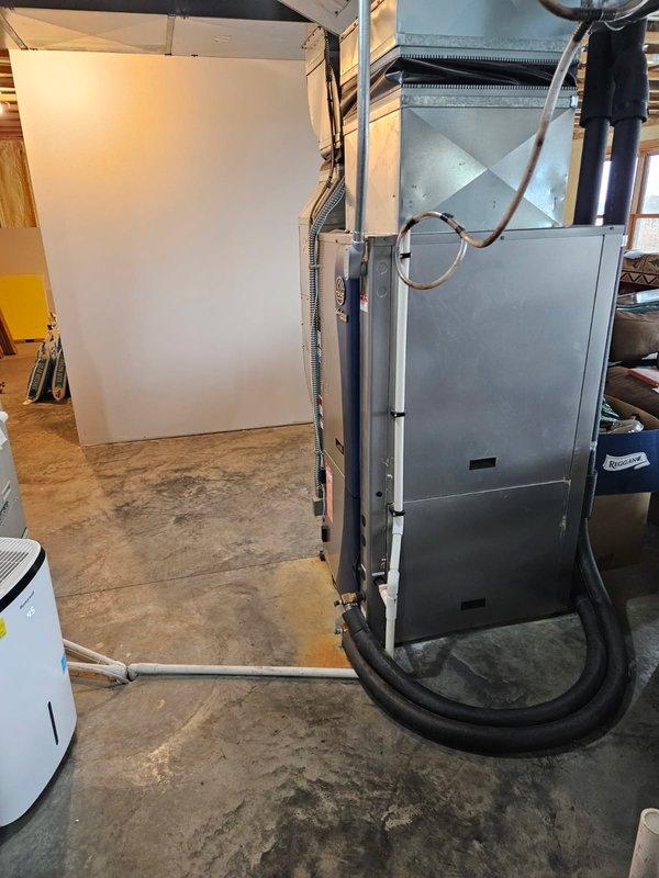 Performed diagnostic assessment on customer's WaterFurnace geothermal system after reports of recurring refrigerant issues. Visual inspection confirmed a leaking evaporator coil with evident oil residue and refrigerant loss at the air handler. Documentation and photos were taken of the system condition to facilitate accurate replacement part ordering for the 69DX coil.