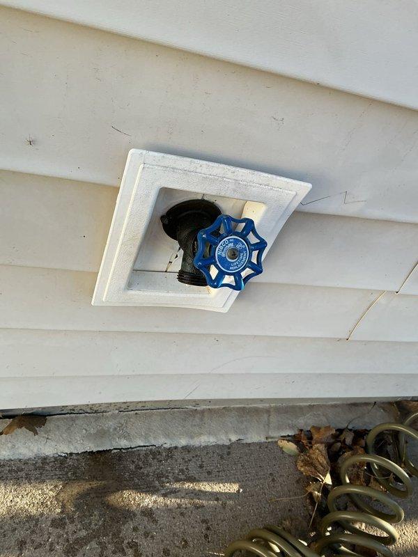 Replaced two malfunctioning outdoor water spigots and installed two new hose bib shutoff valves to resolve leaking issues. Upgraded the garage hose bib with a new unit, featuring proper insulation on supply lines and blue handled shutoff valves with appropriate labeling for improved functionality and accessibility.