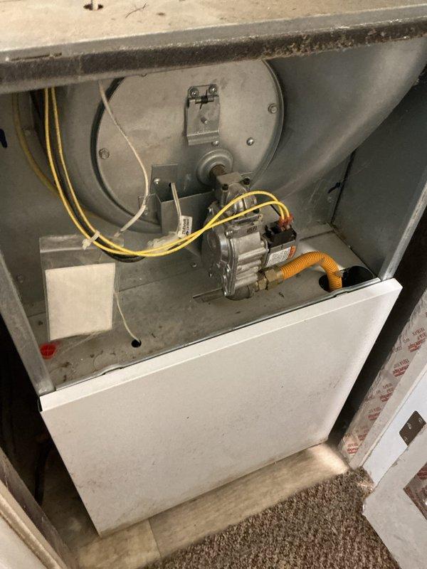 Diagnosed 2018 gas furnace operating with insufficient heat output. System was running but delivering only 65°F air. Inspected gas valve operation and confirmed pressure fluctuation during operation cycles. After consulting with technical support, determined gas valve malfunction was the root cause. Successfully replaced defective gas valve to restore proper heating function.