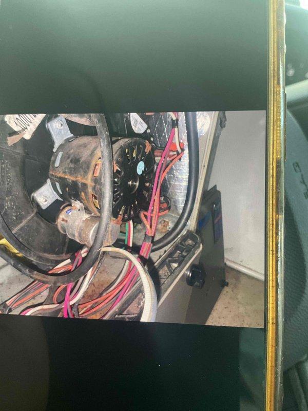 Responded to a no heat call for an aging natural gas furnace (15+ years old). Upon diagnosis, identified a failed inducer motor as the root cause of the system's inability to heat above 65 degrees. Successfully replaced the inducer motor, which showed significant rust, wear, and deterioration on the housing and fan assembly. System now functioning properly.