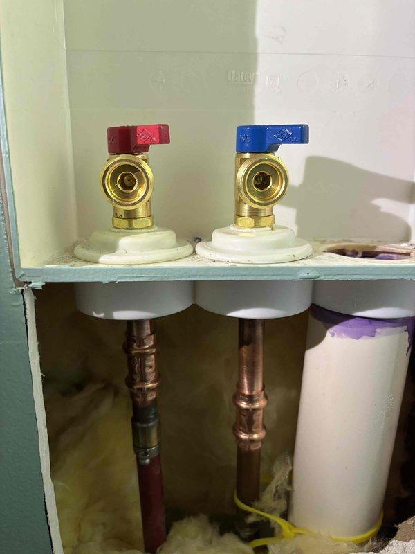 Responded to service call for no water to home. Diagnosed broken washer valve causing leak. Replaced both hot and cold shut-off valves with new brass fixtures to restore proper water flow to residence.