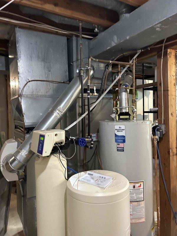 Performed annual furnace tune-up on residential unit of unknown age. Conducted comprehensive inspection including carbon monoxide check, burners, heat exchangers, pressure switch, and flame-roll switch. Found dirty furnace air filters, leaking humidifier, and replaced humidifier tube tip to resolve water leakage. Verified blower wheel motor operating normally.