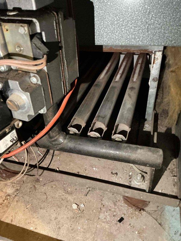 Responded to no-heat call for 30+ year old boiler system. Diagnostic testing confirmed failed gas valve preventing pilot light operation, verified by checking other functioning gas appliances. Determined mercury-based gas valve/thermocouple component is obsolete and unrepairable. Scheduled follow-up with service advisor for boiler replacement consultation.