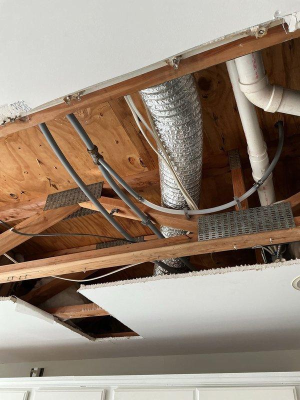 Repaired a leak at the bathroom faucet connection point by replacing deteriorated polybutylene fittings on both hot and cold water lines. Customer had previously removed drywall to expose the slow leak which was dripping into a bucket. Inspected surrounding area for water damage and confirmed proper connection integrity after replacement.