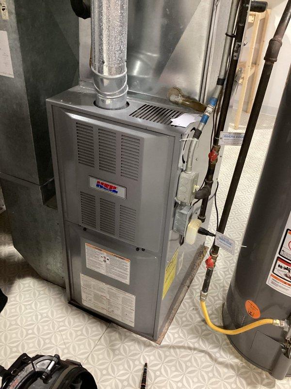 Conducted complete inspection on 21-year-old gas furnace. System burning safely with solid electrical connections. Identified and replaced out-of-range capacitor that would have caused operational issues. Verified clean filter and burners. Performed electrical testing with clamp meter showing 4.759 amp reading, confirming system is operating within normal parameters.