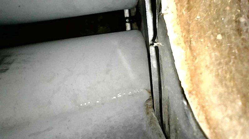 Performed furnace tune-up on FRP unit of undetermined age. Discovered critical safety issues including cracked heat exchanger, significant soot buildup inside heat exchanger, mold accumulation on components, and a stuck inducer motor. Upon testing, unit produced extremely dangerous CO levels exceeding 3,000 ppm as verified with Testo analyzer. Red-tagged furnace as unsafe for operation and recommended replacement options.