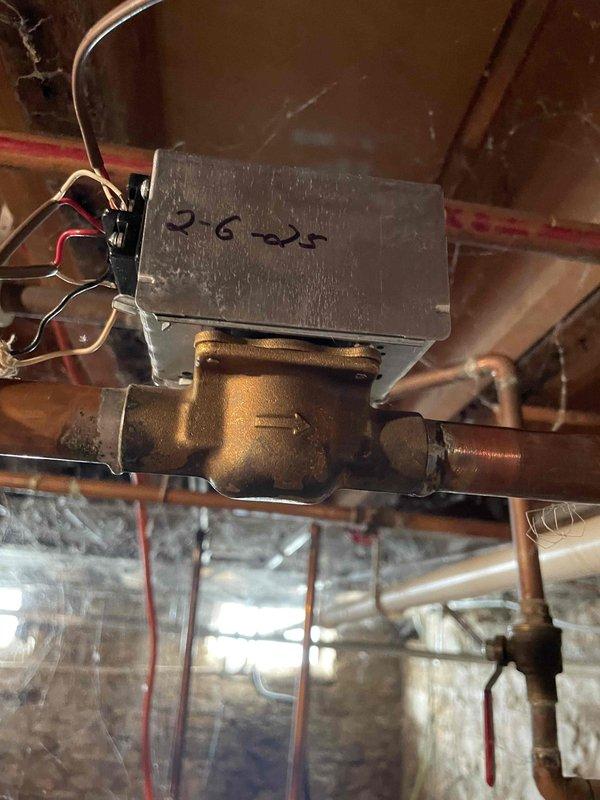 Responded to no heat service call for 10+ year old boiler system. Diagnosed main level zone valve stuck in closed position. Temporarily restored function by removing power to free valve, likely due to rust particles from black iron pipes obstructing operation. Replaced zone valve diaphragm and installed new expansion tank to prevent recurrence of issue.