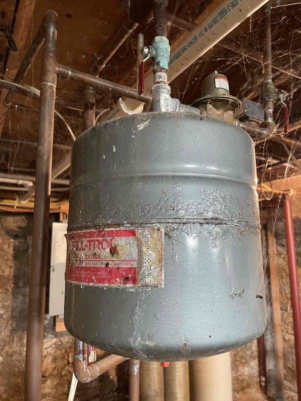 Responded to no heat service call for 10+ year old boiler system. Diagnosed main level zone valve stuck in closed position. Temporarily restored function by removing power to free valve, likely due to rust particles from black iron pipes obstructing operation. Replaced zone valve diaphragm and installed new expansion tank to prevent recurrence of issue.