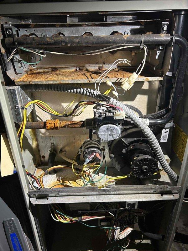 Responded to no-heat service call for 2008 American Standard furnace. Diagnosed a crack on the right top burner extending past the crimp, confirmed via visual inspection with homeowner. Tagged unit as unsafe to operate and recommended immediate repairs. Noted the outdoor AC unit (American Standard, 1992) is also at end of life; customer expressed interest in full system replacement.