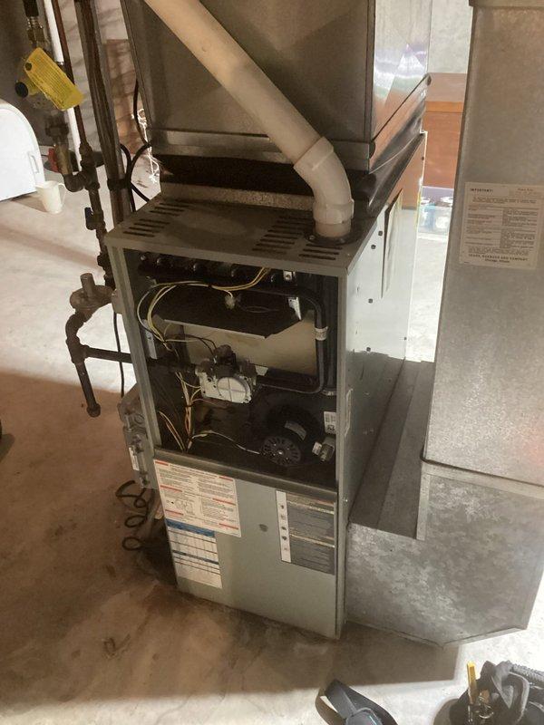 Responded to no heat call for 10+ year old HVAC system. Diagnosed failed control board and performed heat exchanger inspection, which revealed significant cracking above the limit hole - typical Trane failure pattern. System running but producing insufficient heat. Scheduled service advisor to provide replacement options for both furnace and AC components.