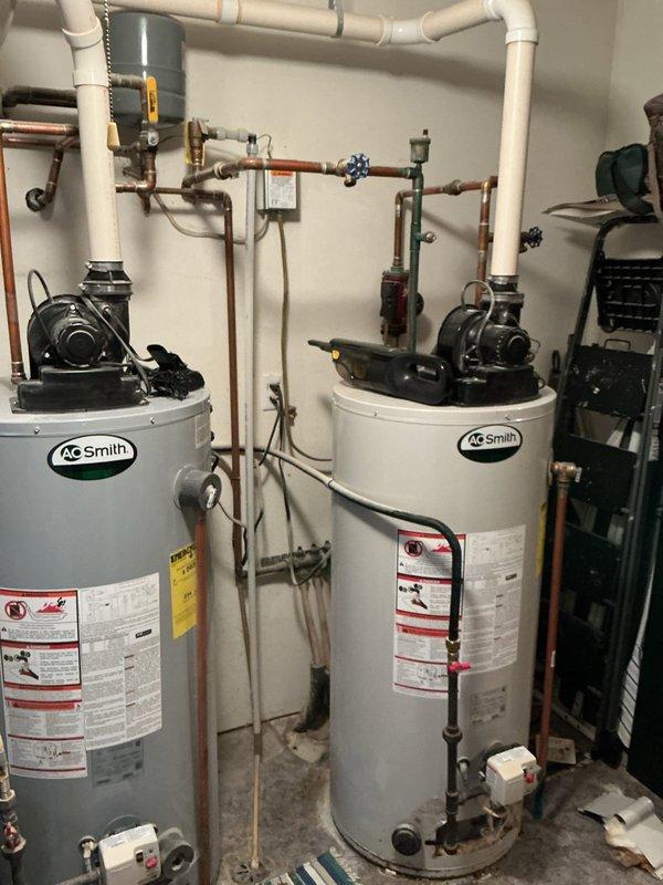 Responded to service call for A.O. Smith water heater displaying error code 6-3 and failing to ignite, resulting in no hot water for in-floor heating system. Diagnostic testing revealed faulty gas valve and damaged burner assembly. Presented customer with options to either replace these components or consider complete unit replacement. Customer advised to consult with service advisor regarding potential new unit installation.