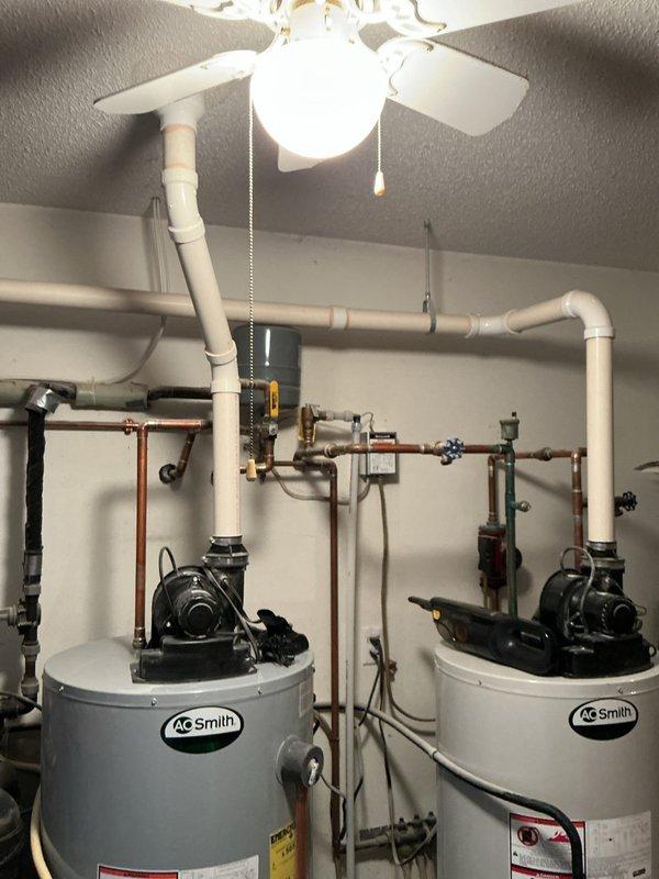 Responded to service call for A.O. Smith water heater displaying error code 6-3 and failing to ignite, resulting in no hot water for in-floor heating system. Diagnostic testing revealed faulty gas valve and damaged burner assembly. Presented customer with options to either replace these components or consider complete unit replacement. Customer advised to consult with service advisor regarding potential new unit installation.