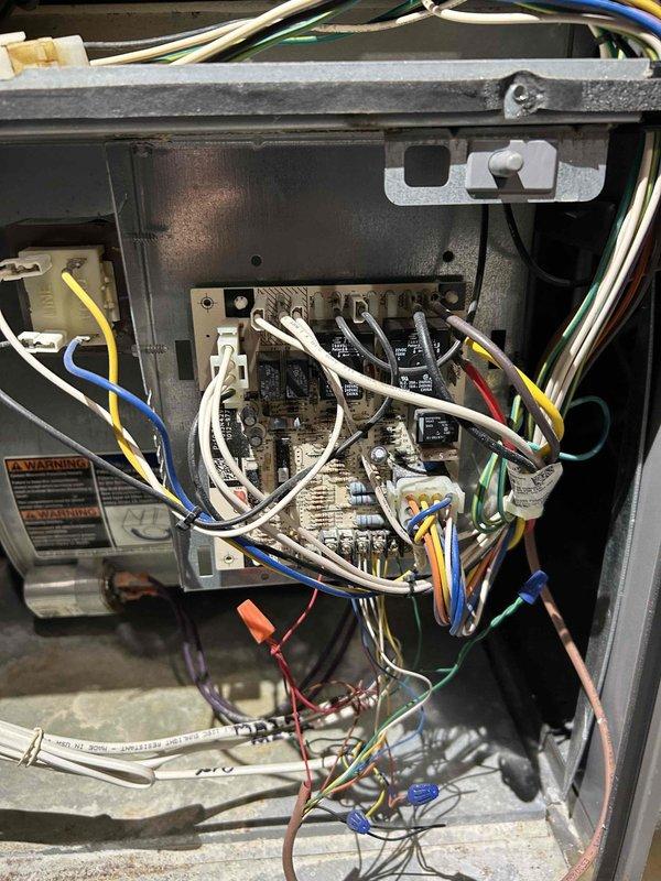 Performed comprehensive furnace tune-up on Lennox unit (approximately 10 years old). Identified significant rust and water leakage throughout top and bottom of furnace. Conducted carbon monoxide testing with acceptable PPM readings and verified proper gas pressure. Replaced air filter and humidifier panel, installed condensation trap on exhaust, and cleared condensation using CO2. System returned to functional condition despite corrosion issues.