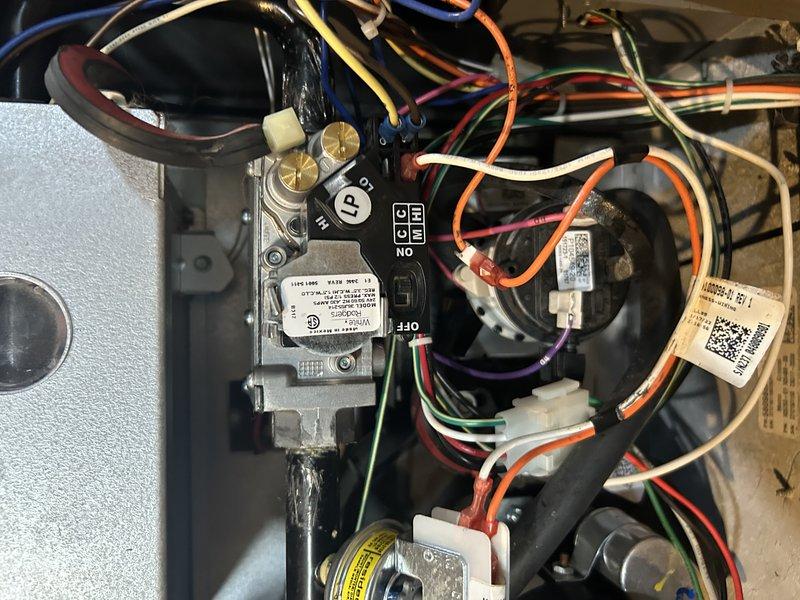 Diagnosed furnace system exhibiting no heat condition and displaying error code HE270. Found gas valve was not opening properly while all other components functioned normally. Replaced defective gas valve under warranty and re-crimped wire connections to address corrosion issues. Set proper gas pressures and verified system operation, restoring normal heating functionality.