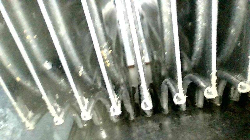 Responded to customer complaint of noise from furnace blower area during startup. Investigation revealed secondary heat exchanger with multiple pin holes identified via camera inspection. Cleared partially filled condensate trap which was likely source of gurgling noise. Conducted combustion check with normal CO readings. Tagged system as unsafe and provided information on heat exchanger replacement options.