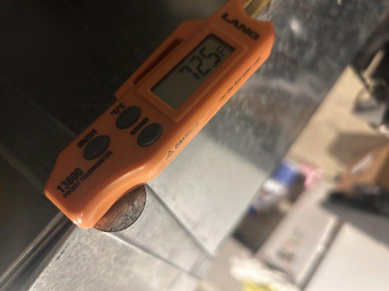 Performed bi-annual tune-up on 19-year-old natural gas furnace. Conducted functional test for 20 minutes with satisfactory temperature rise and combustion readings. Identified weakening igniter (17 ohms), deteriorating inducer motor capacitor (6.5/7.5 µF), failing inducer motor seal with evidence of leakage, and burnt-out UV bulb. Customer approved UV bulb replacement and requested estimates for collector box replacement, duct cleaning services, and furnace replacement options.