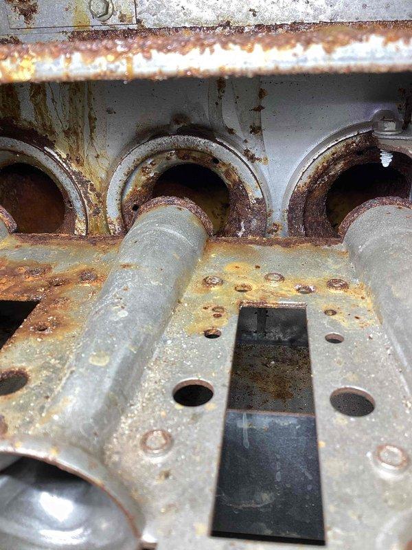 Responded to service call for 12-year-old NG furnace producing rattling noise and slight odor with limited heat output. Diagnostic inspection revealed non-functioning ignition system with failed ignitor, extensive rust damage to heat exchanger and burners, and corroded roll out switch preventing safe operation. Due to multiple critical component failures and advanced system age, recommended full system replacement and scheduled comfort advisor consultation.