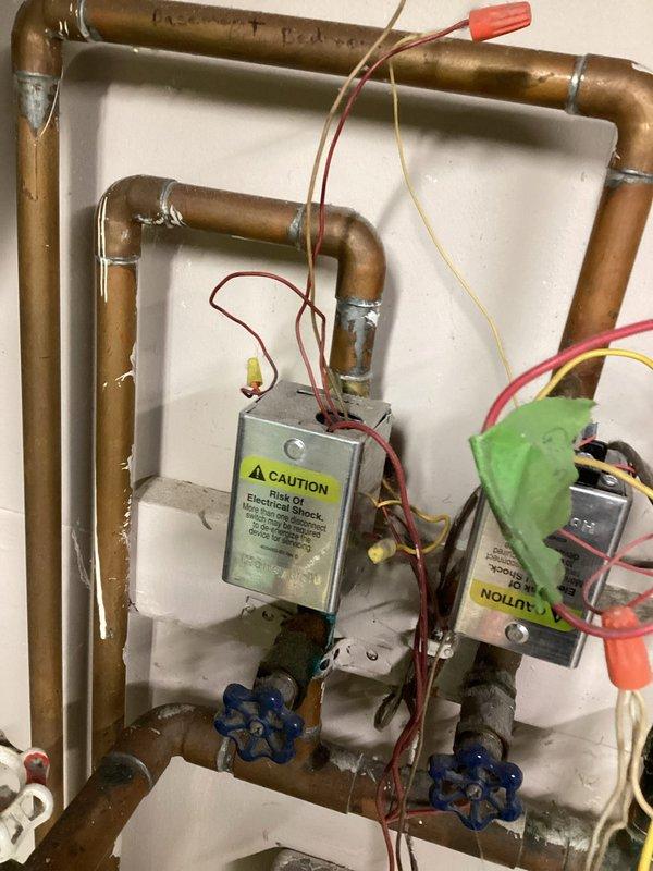 Diagnosed no heat issue on aging boiler system with four zone valves. Found thermostats calling for heat with zone valves opening but failing to activate end switches due to faulty wiring connections. Corrected the issue by rewiring all zone valves, verified proper operation of each zone valve and confirmed all zones successfully activate the boiler. System now functioning normally. Recommended backflow preventer installation.