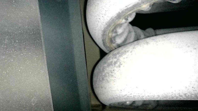 Performed comprehensive furnace tune-up on 8-year-old primary residential unit and garage hanging unit. Replaced humidifier pad, checked all electrical components, cleared condensate lines, and inspected heat exchangers—noting stress on garage unit's heat exchanger back bends but no compromises requiring immediate attention. Both systems tested for proper operation with primary unit showing appropriate temperature rise of 55 degrees and gas pressures within specification.