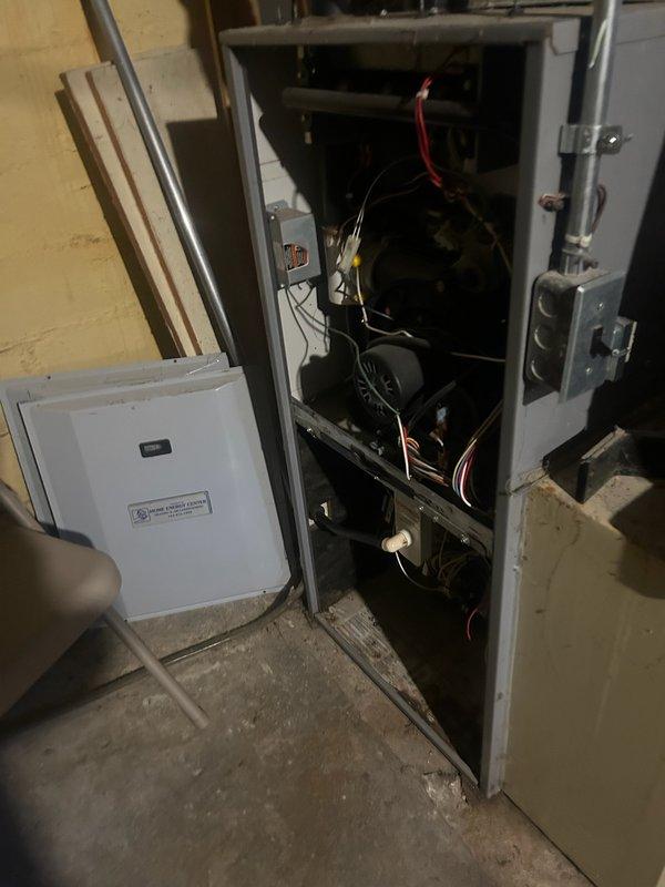 Responded to no-heat service call for 20-year-old natural gas furnace. Diagnosed failed ECM blower motor after verifying proper operation of flame sensor, ignitor, pressure switches, safety switches, and inducer motor. Successfully cycled system to confirm burners light but blower remains inoperative. Ordered replacement part and scheduled return service with Comfort Advisor.